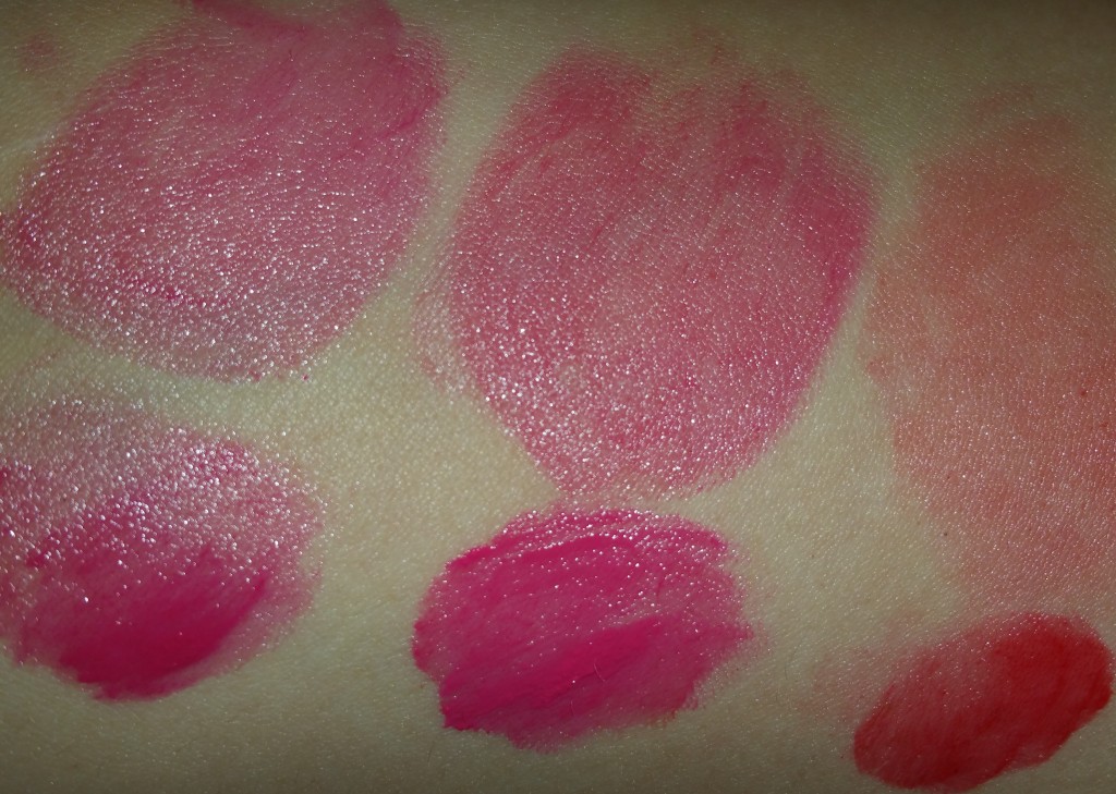 Left to right: Bobbi Brown Nourishing Lip Color in Bright Raspberry, Cosmic Peony, and Poppy - swatched on arm with flash
