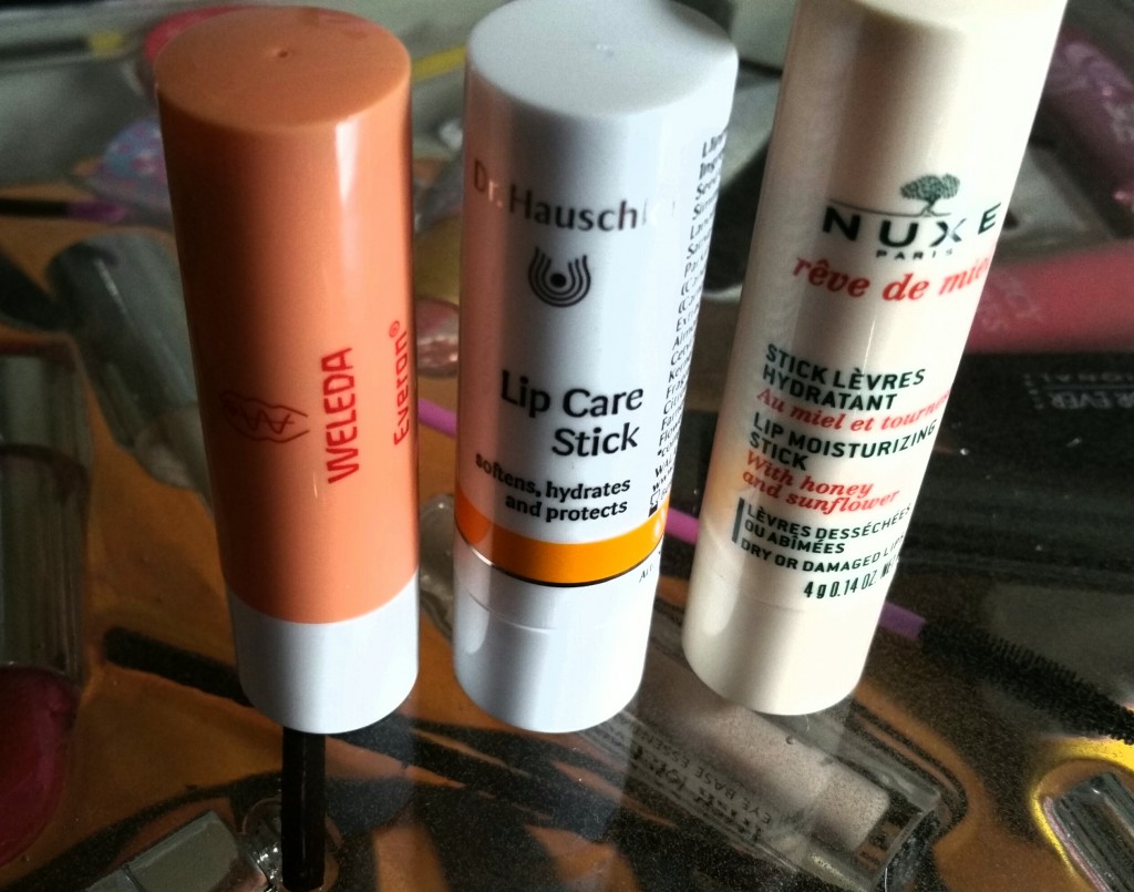 Left to right: Weleda Everon Lip Balm, Dr. Hauschka Lip Care Stick, and Nuxe Reve de Miel Lip Moisturizing Stick