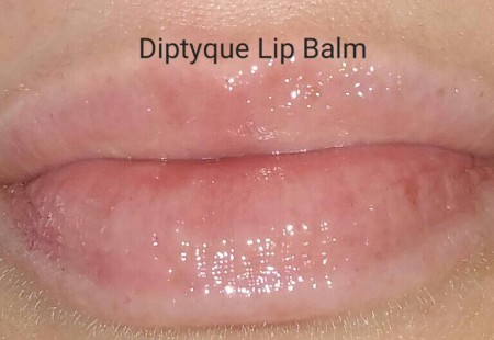 Diptyque L'Art Du Soin Lip Balm swatched on lips - with flash