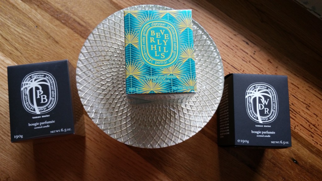 Left to right: Diptyque / Tomas Maier Palm Beach candle, Diptyque Beverly Hills candle, and Diptyque / Tomas Maier West District Road candle.
