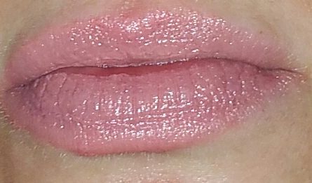 Coola Mineral Liplux SPF 30 in Nude Beach swatched on lips with flash