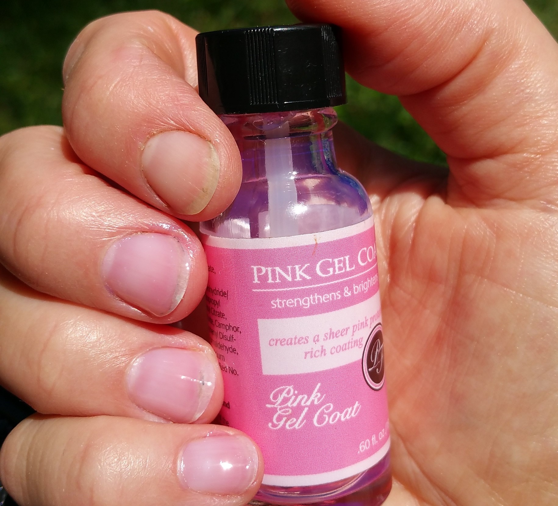 Swatch of Perfect Formula Pink Gel Coat Nail Polish and Bare Nail Index Finger