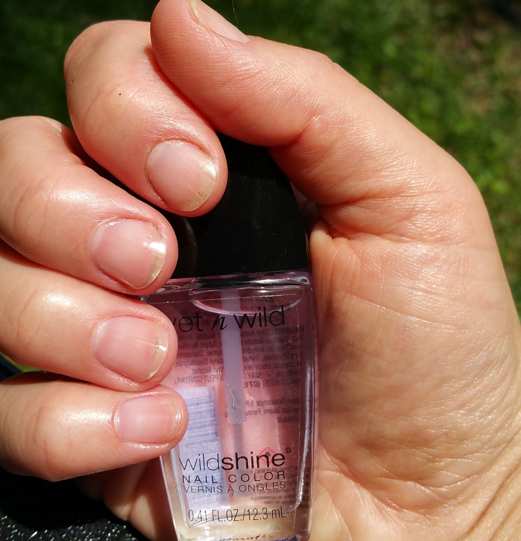 Swatch of Wet N Wild WildShine Nail Polish and Bare Nail Index Finger