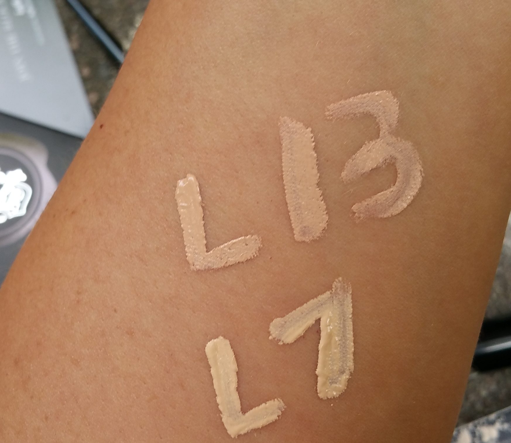 Kat Von D Beauty Lock-It Creme Concealers, in shades L13 (Cool) and L7 (Warm), left to right.
