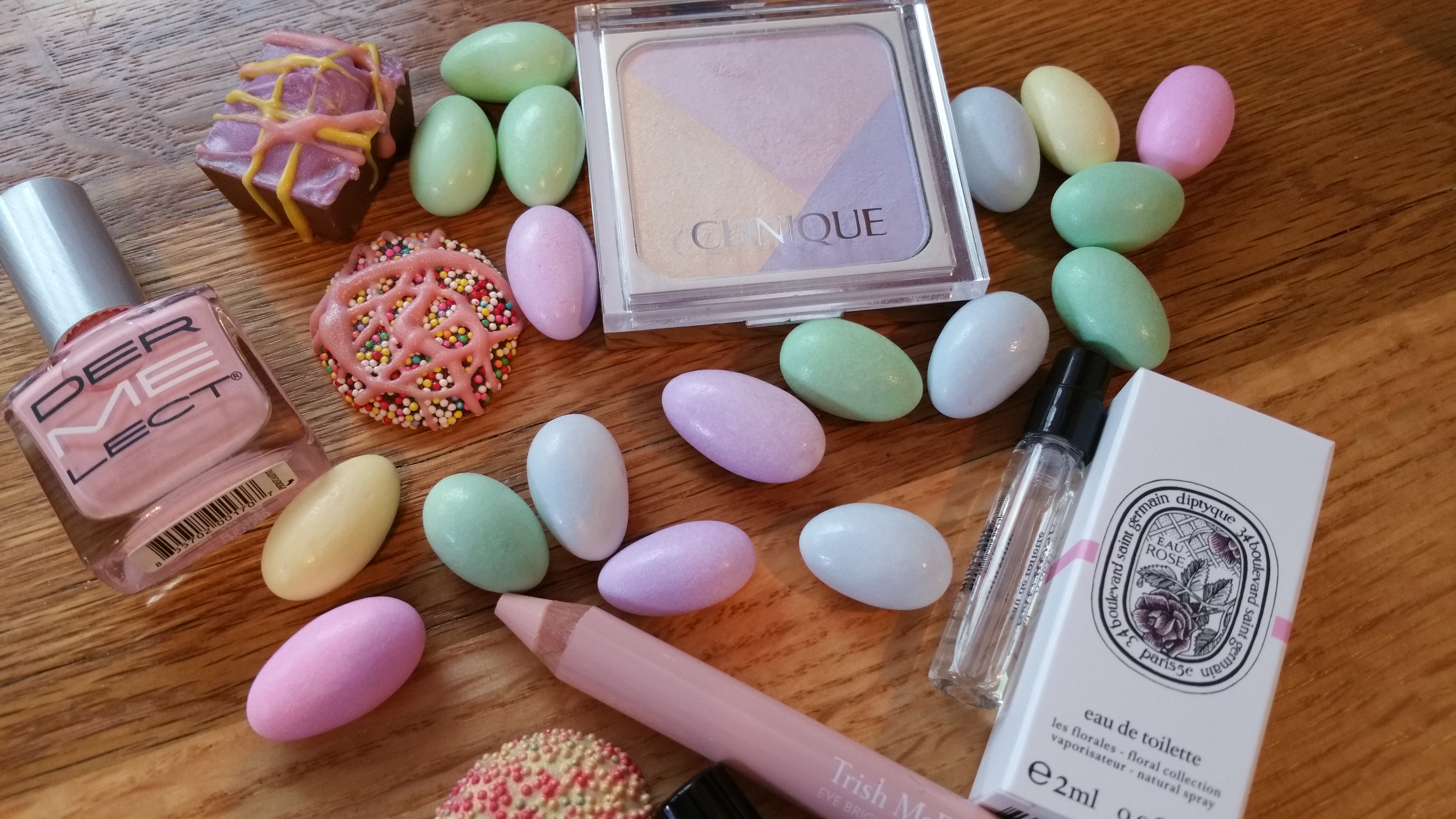 Clockwise from top Left: Dermelect Peptide Nail Polish - Persuasive Clinique Sculptionary Pallete, Defining Sugars, Diptyque EDT Eau Rose, Trish McEvoy Eye Brightener - Shell